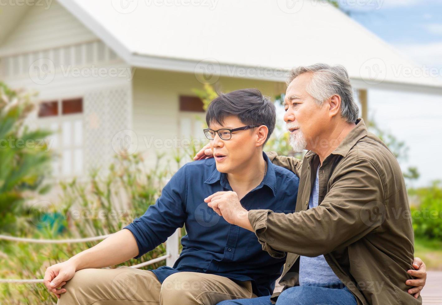 Senior asian father and middle aged son sitting relax together outdoors, Senior father give advice adult son, Happiness asian family concepts photo