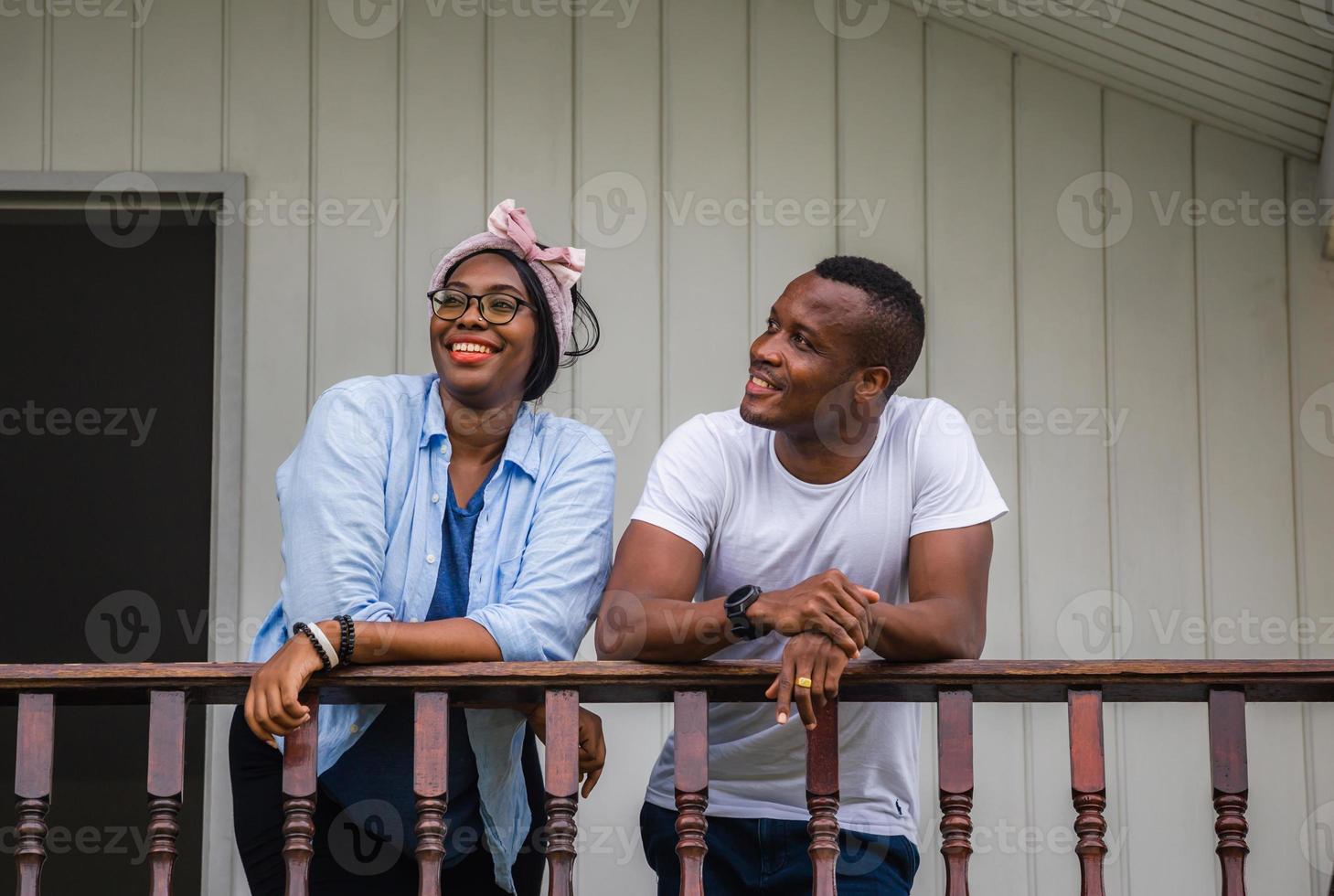 Cheerful african american couple at wooden balcony, happiness family concepts photo