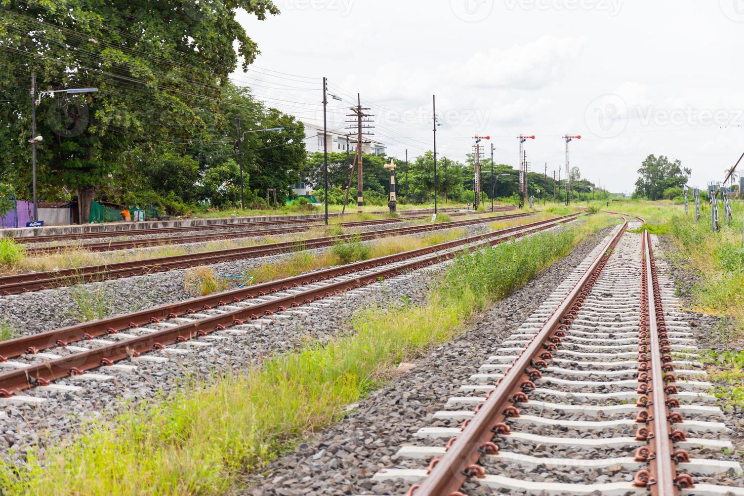 railroad tracks with rust on rock background photo