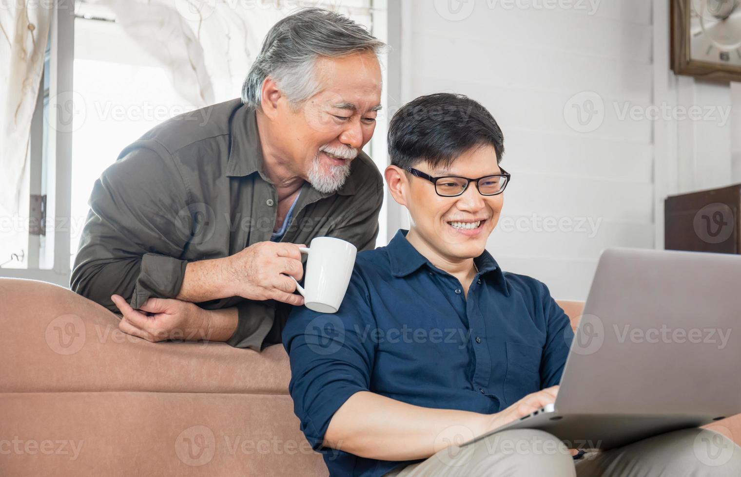 Cheerful asian middle aged son and senior father in living room, Happiness Asian family concepts photo