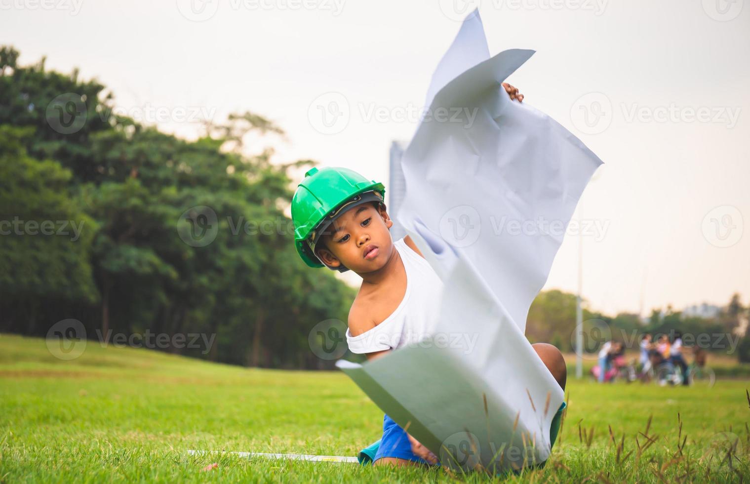 Portrait of happy african american kids boy playing outdoors in a park, Kid playing concept. photo