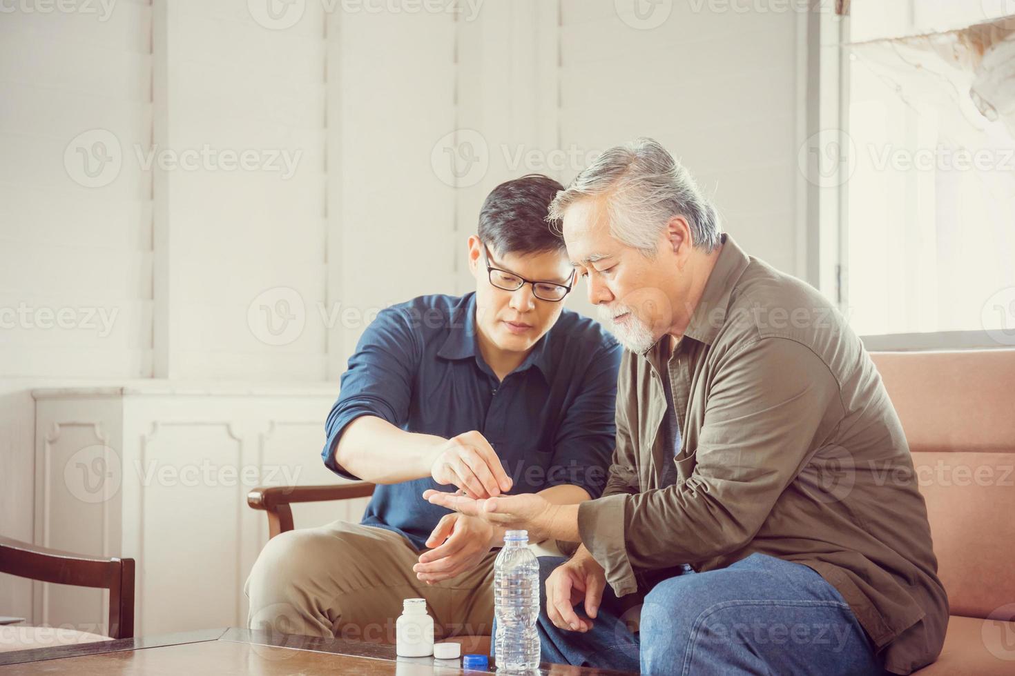 Middle aged son takes care of sick senior father, Happiness Asian family concepts photo