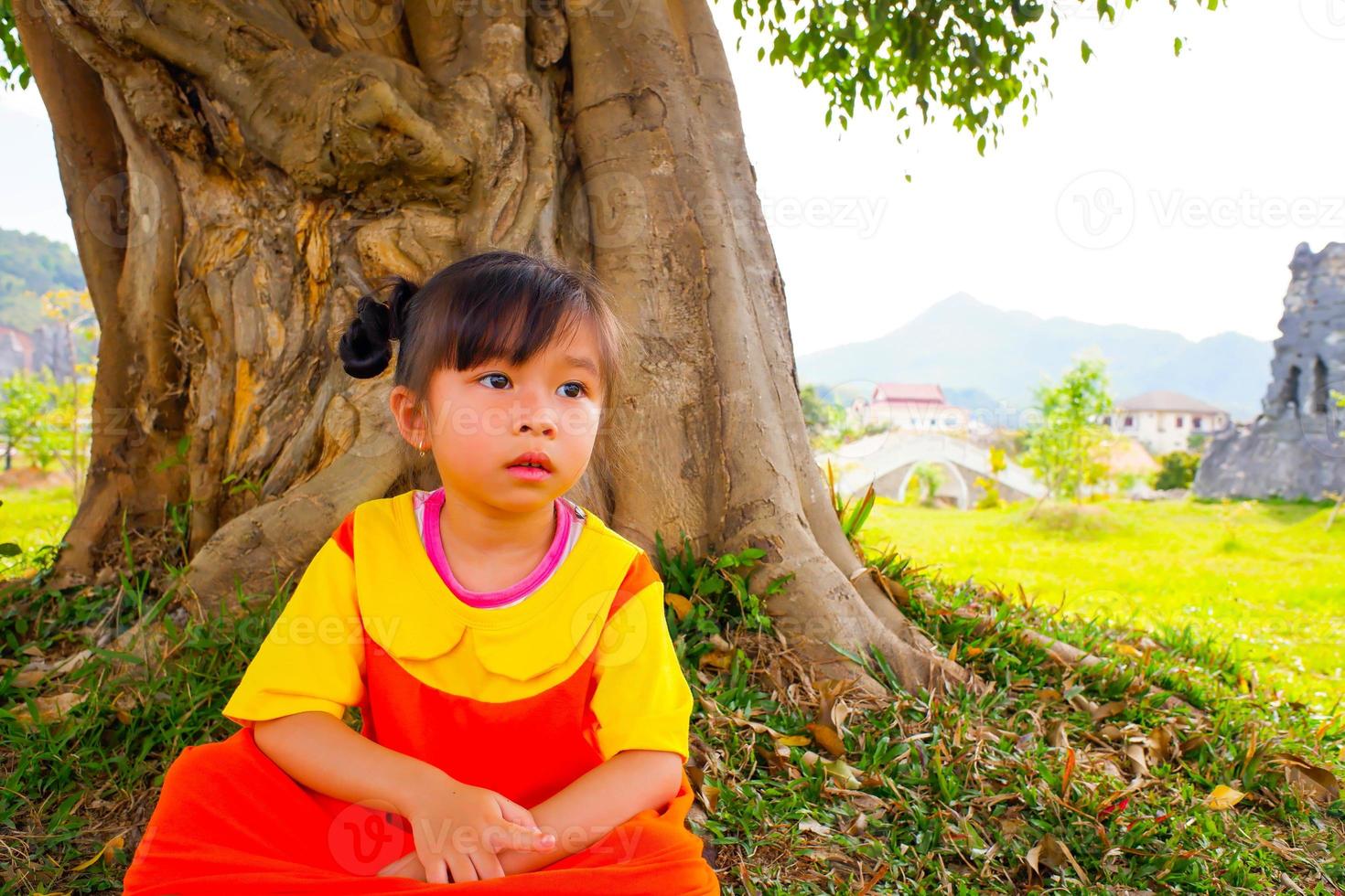 Lovely Baby girl wears yellow-orange outfit gokowa outfit, Mugunghwa in a public park. Girls and teen fashion dress. photo