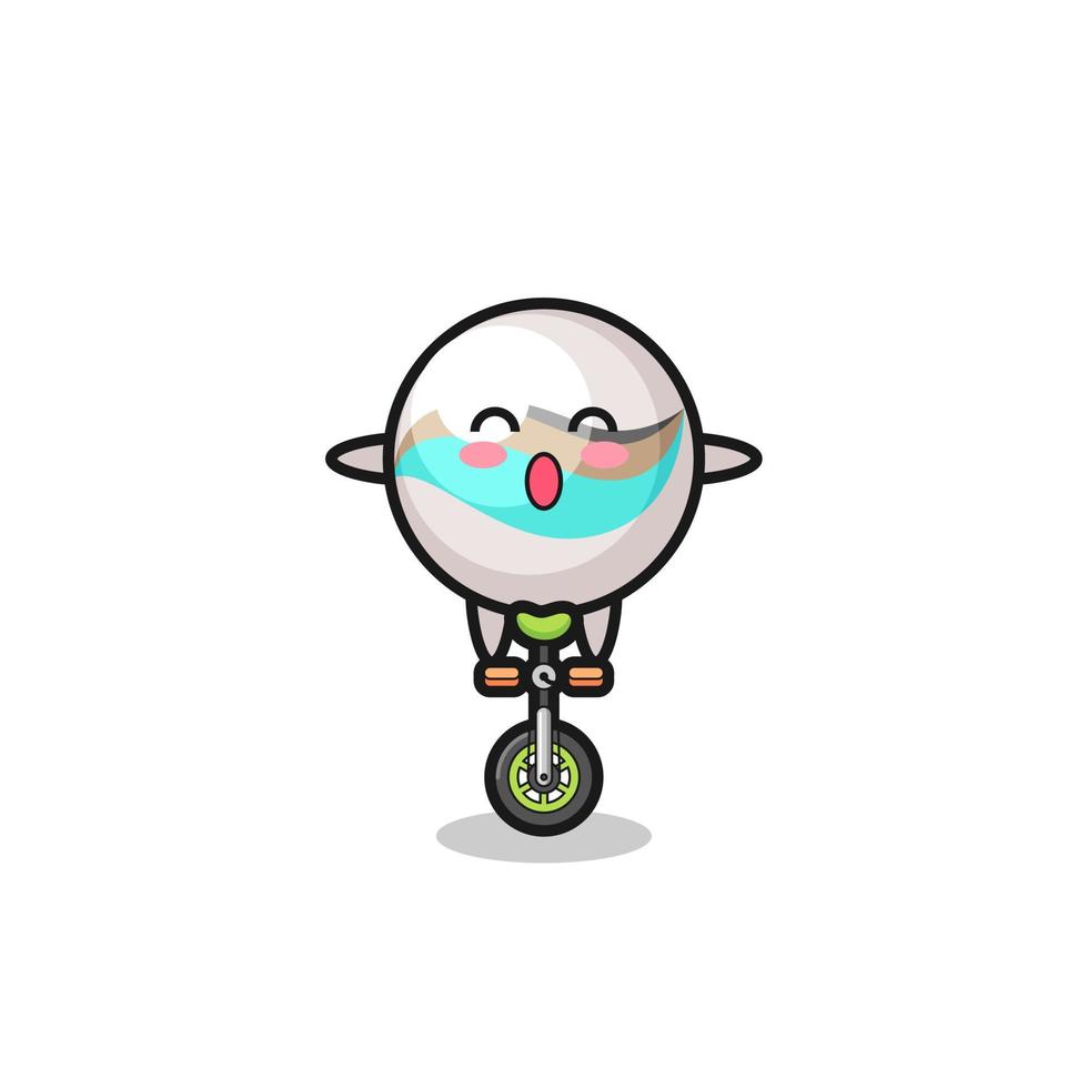 The cute marble toy character is riding a circus bike vector