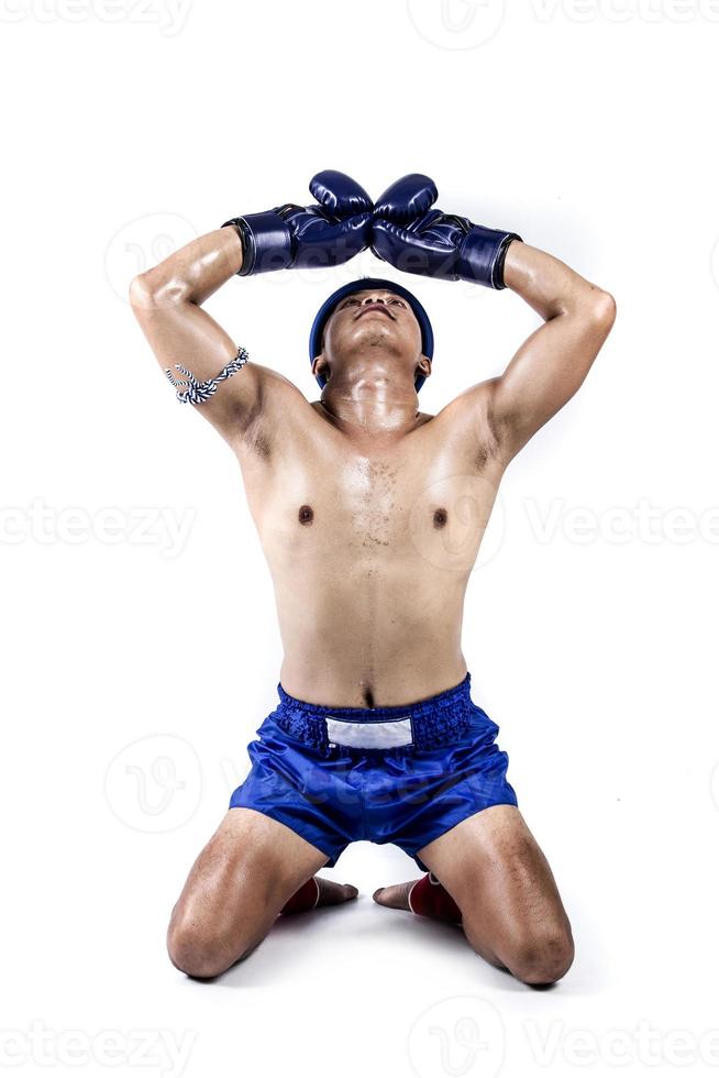 Thai boxer with thai boxing action, isolated on white background photo