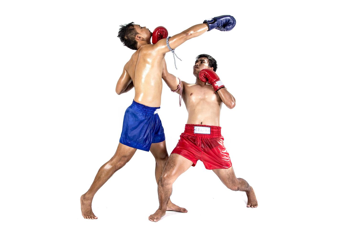 Two thai boxers exercising traditional martial art, Isolated on white background photo