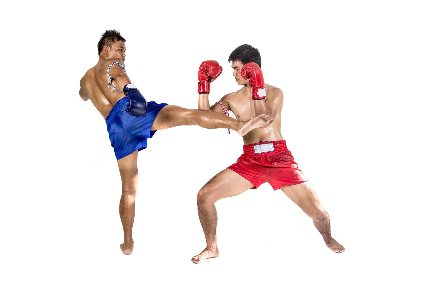 Two thai boxers exercising traditional martial art, Isolated on white background photo