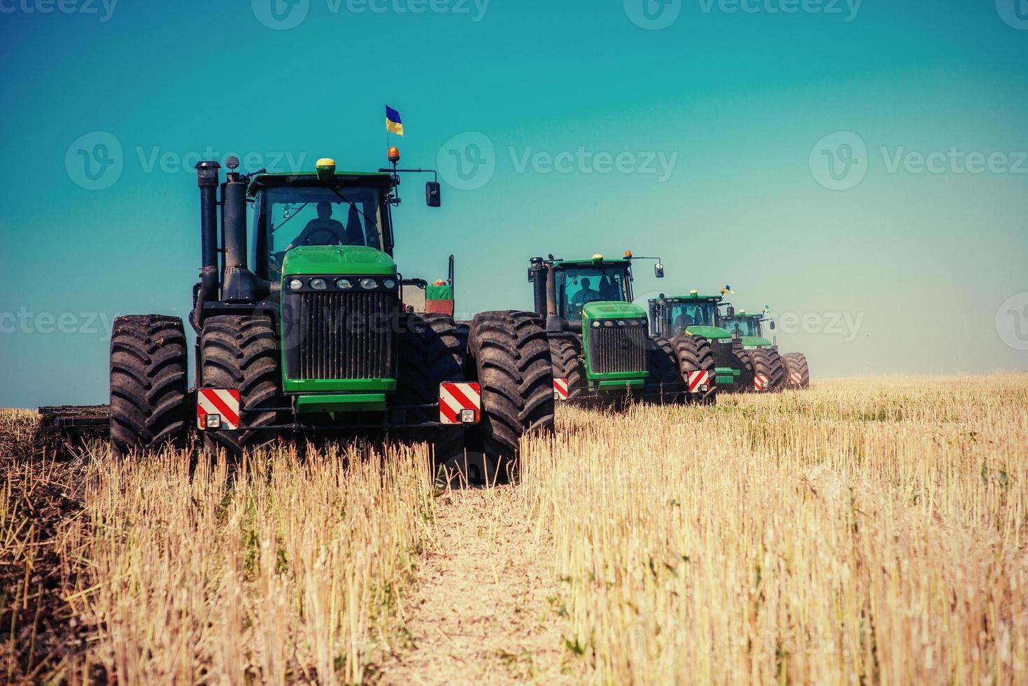 ractors working in the field photo