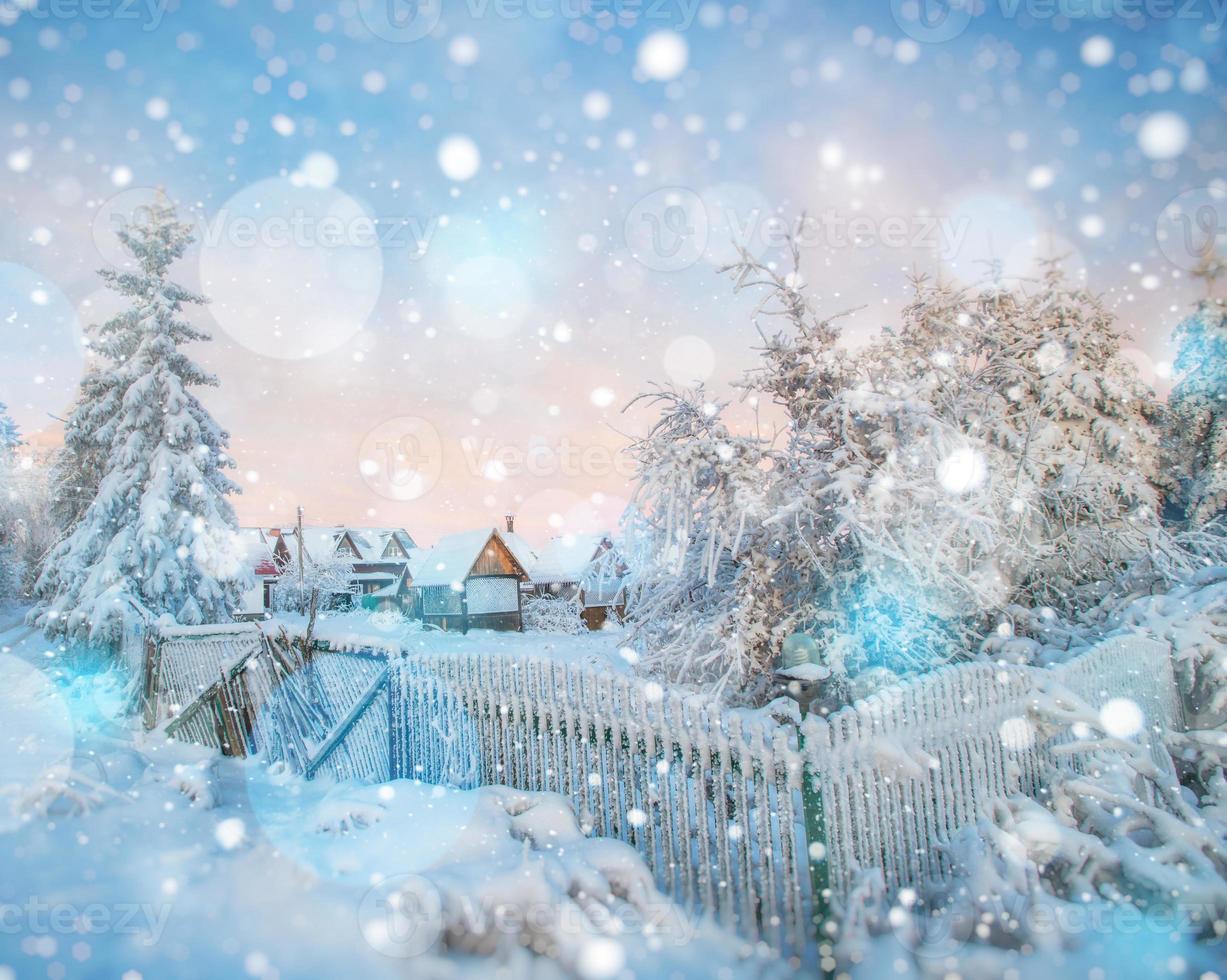 chalets in the mountains at sunset. Winter greetings photo