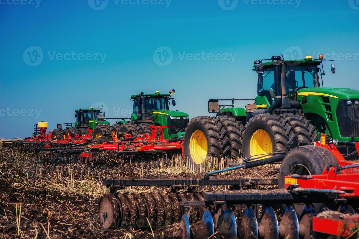 ractors working in the field photo
