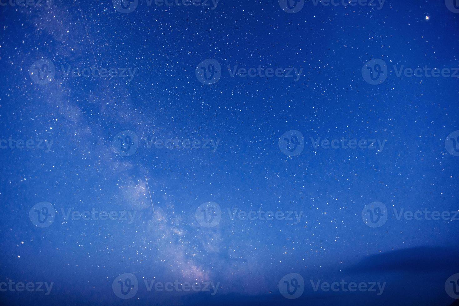 fantastic winter meteor shower and the snow-capped mountains. photo