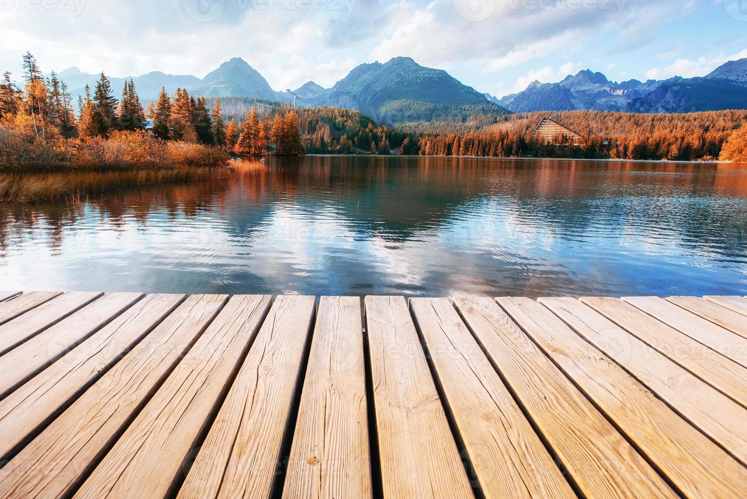 The sunrise over a lake in the park High Tatras. Shtrbske Pleso, photo