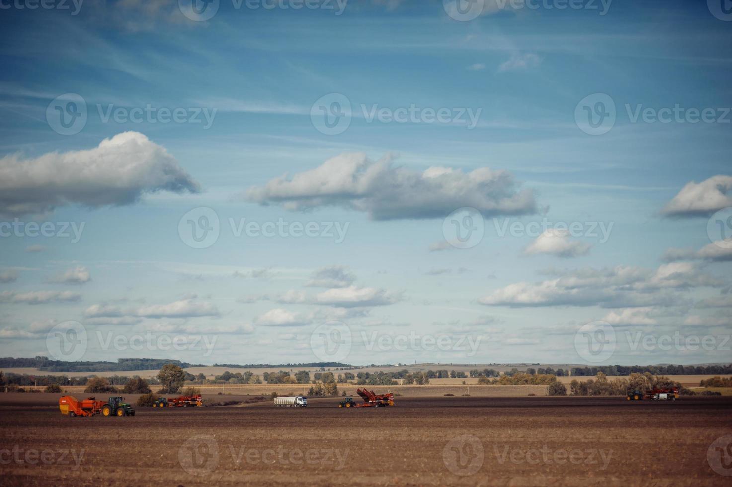 Tractor plowing up the field. photo