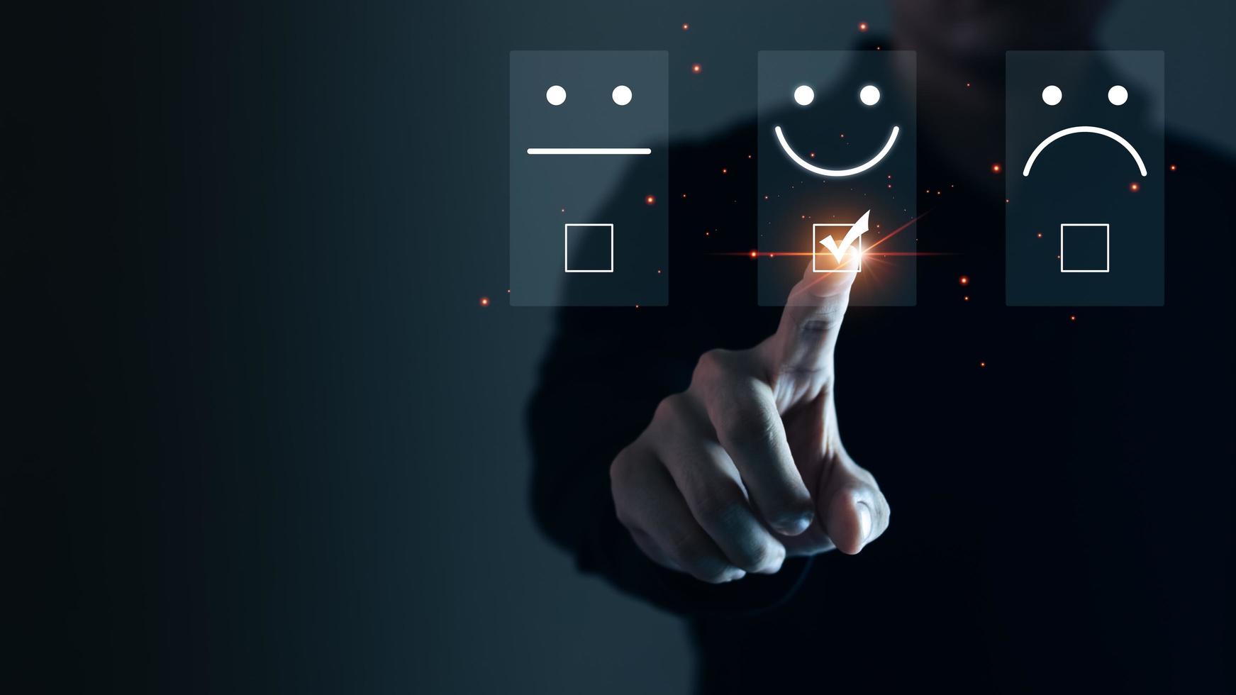 Businessmen are choosing screen on the happy Smiley face icon to give satisfaction in service, Customer service and Satisfaction concept, rating very impressed. photo