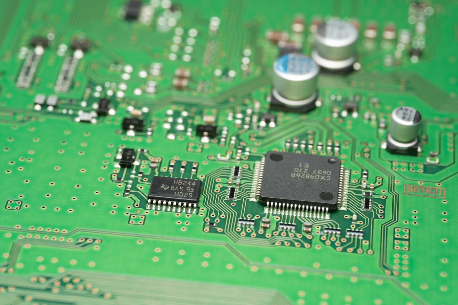 chip on green pcb board. Electronic circuit board close up. photo