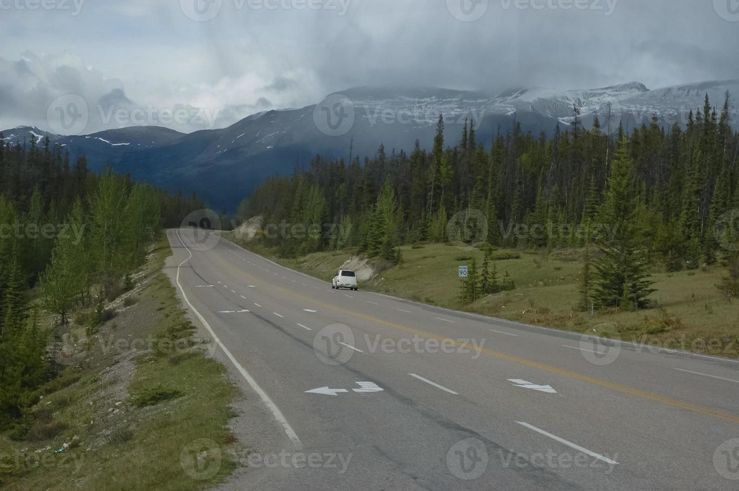 Dark long freeway in a mountain photo