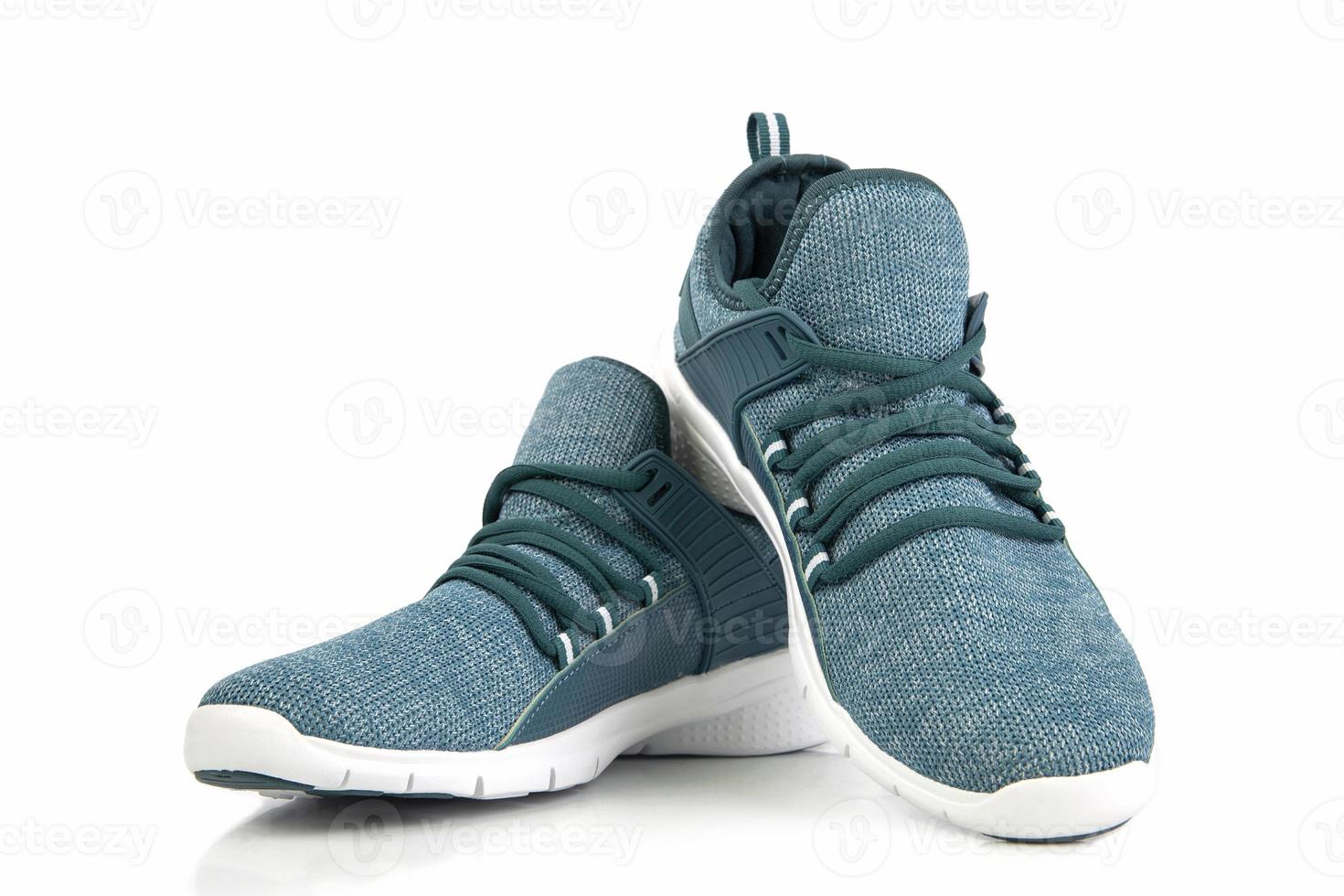 Green sneakers or sport running shoe isolated on a white background photo