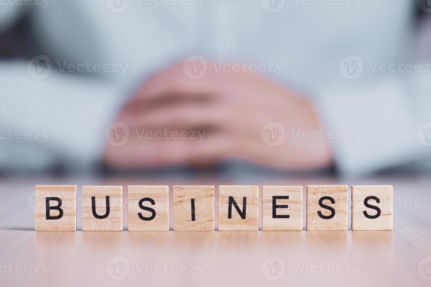 Business word close up on wooden block cubes. business creative motivation concept photo