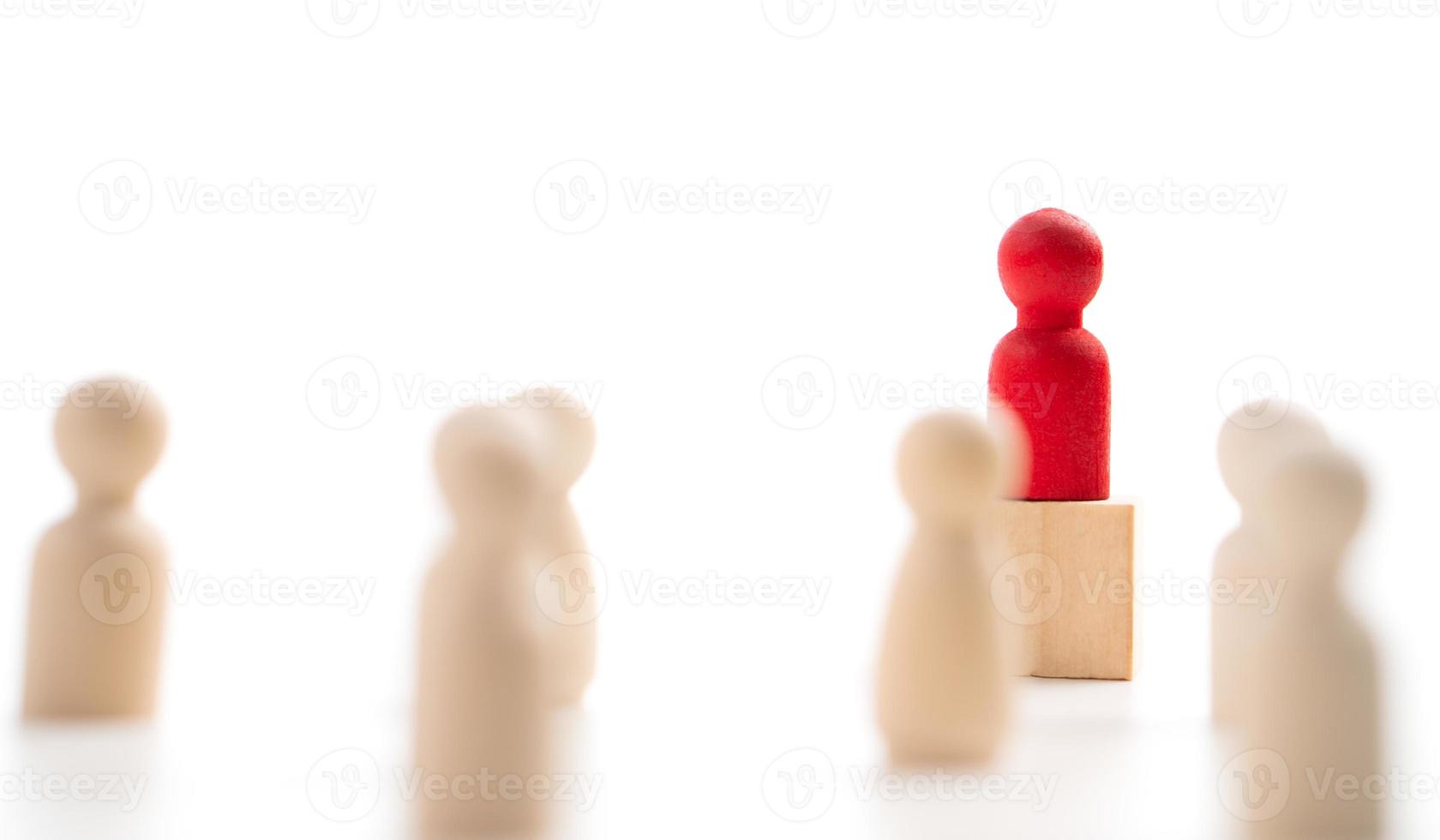 The red wooden figure standing on the box show influence and empowerment. Concept of business leadership for leader team, successful competition winner and Leader with influence photo