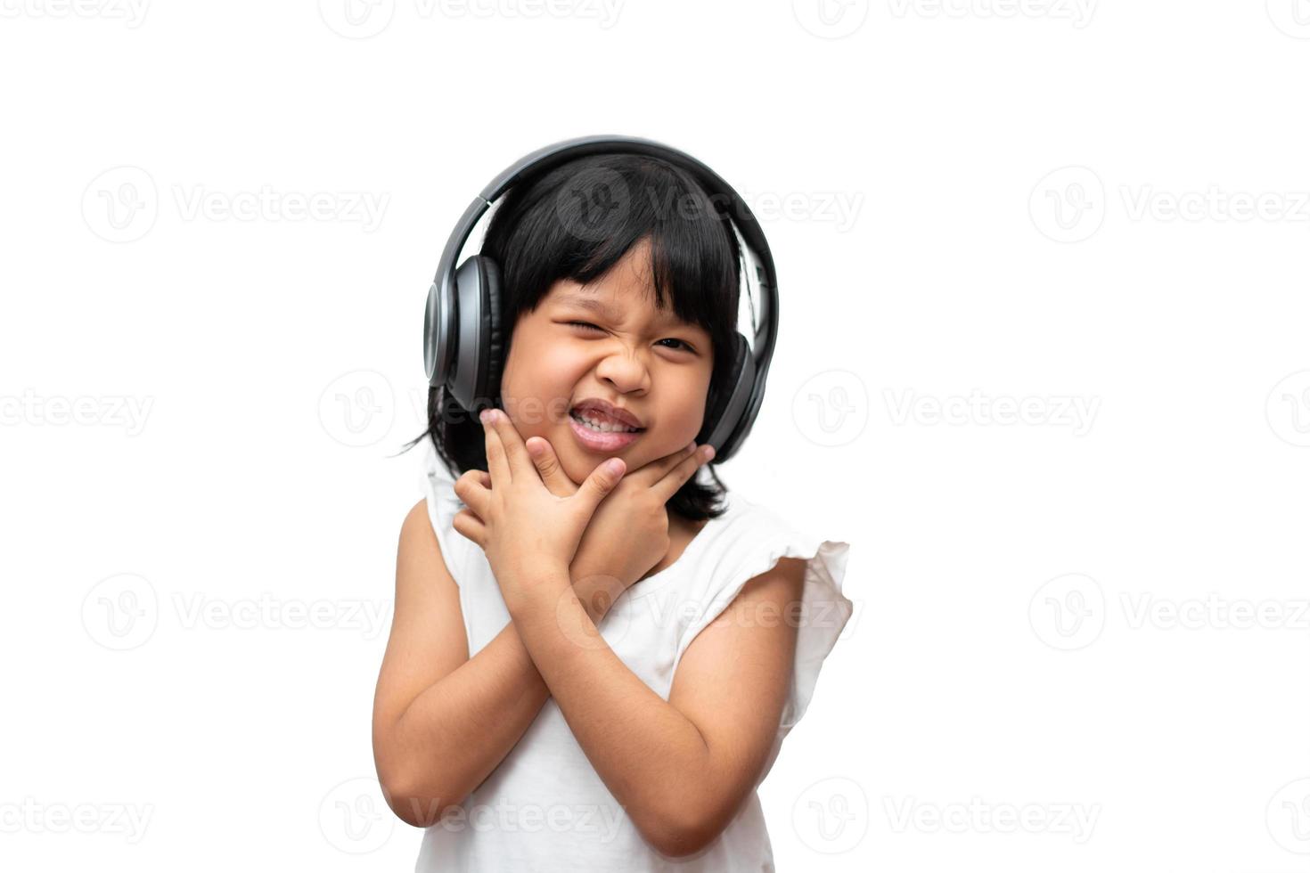 Portrait of happy and funny Asian child girl on white background, a child looking at camera hand gesture. Preschool kid dreaming fill with energy feeling healthy and good concept photo