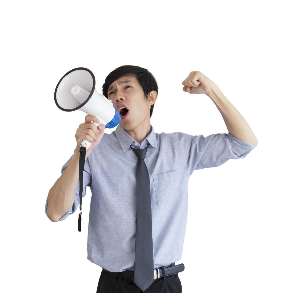 portrait of a young Asian man shouting with a megaphone isolated on white background. photo