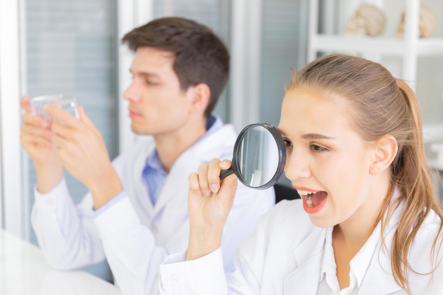 Laboratory research Teamwork, people, scientists analyze data, study and assess the success of magnifiers. Healthcare researchers conducting research with science, chemical testing. photo