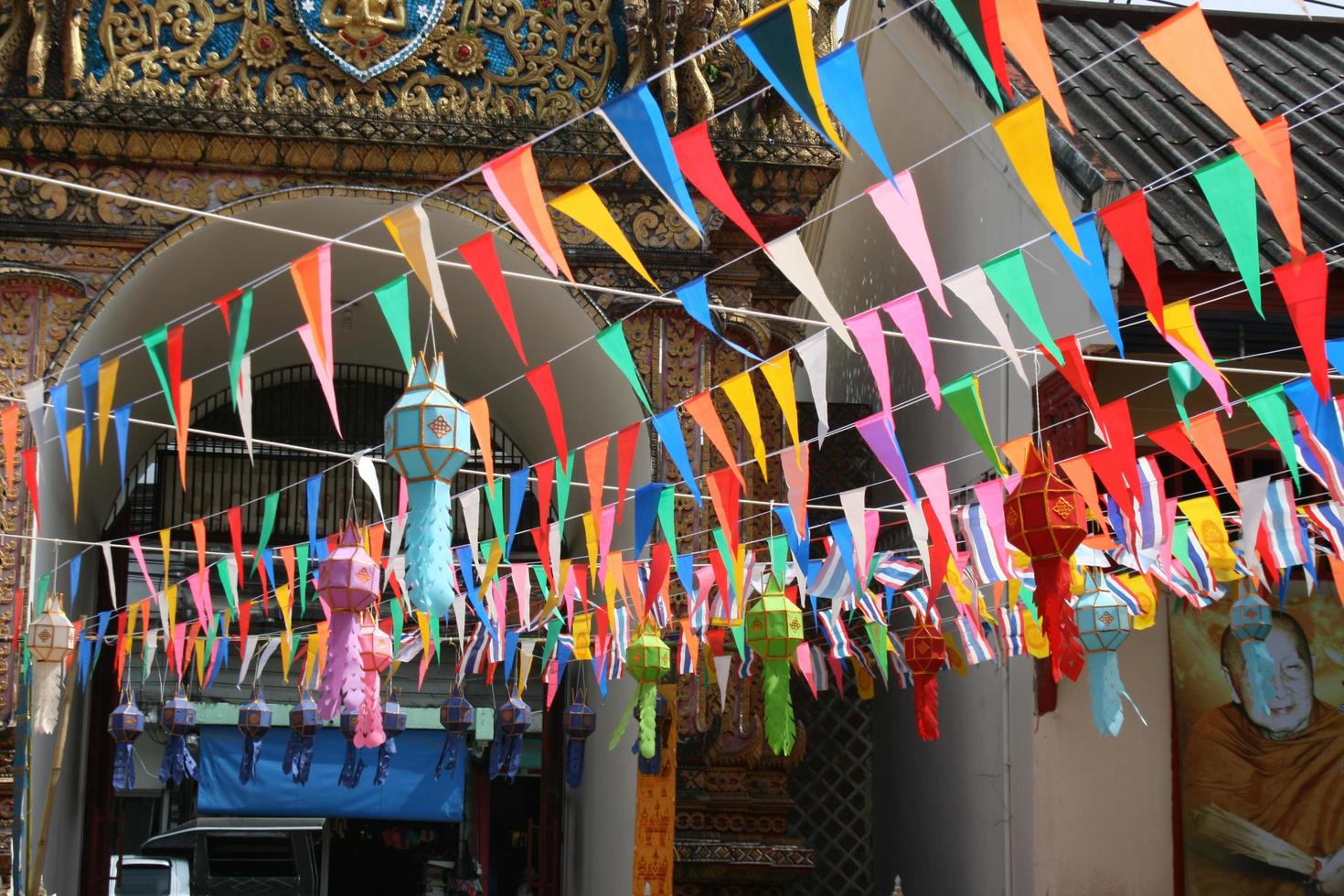 Colorful flag decorations in northern Thai temples photo