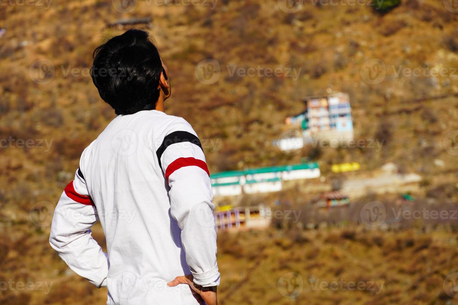 man looking view of himachal pradesh from backside photo