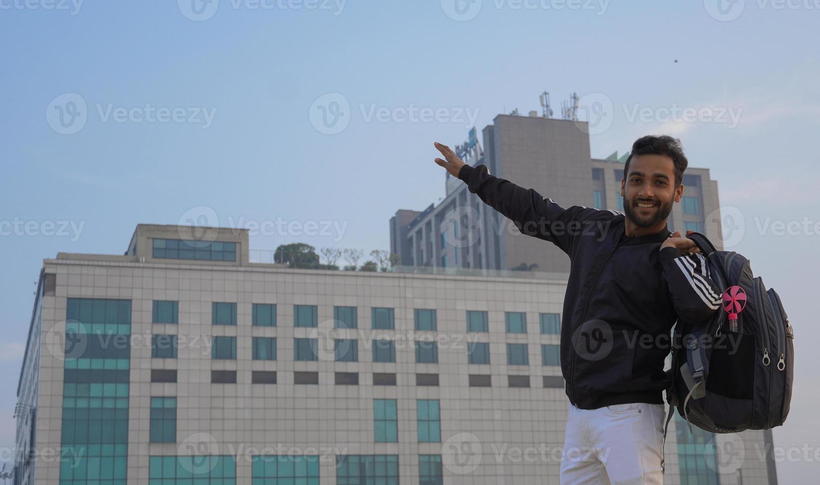 A boy trying to show fly gesture in the university photo