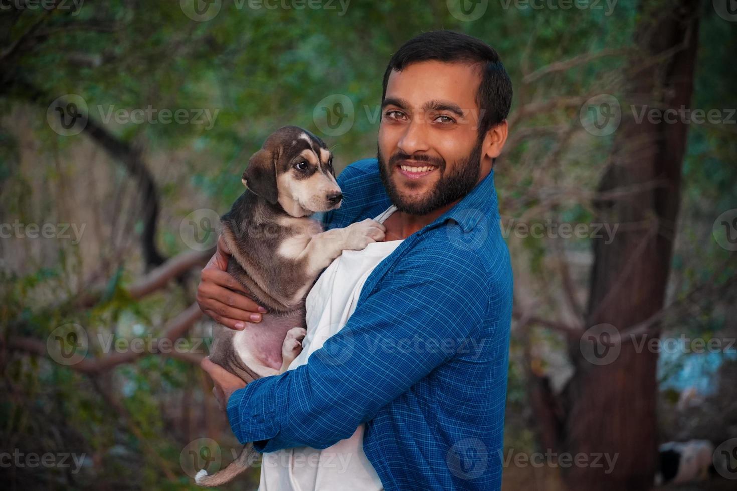 man with indian street dog photo