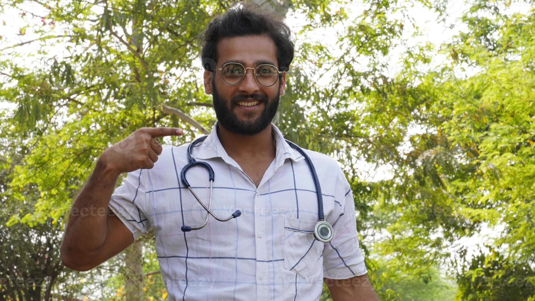 Happy medical student with stethoscope and showing and happy photo