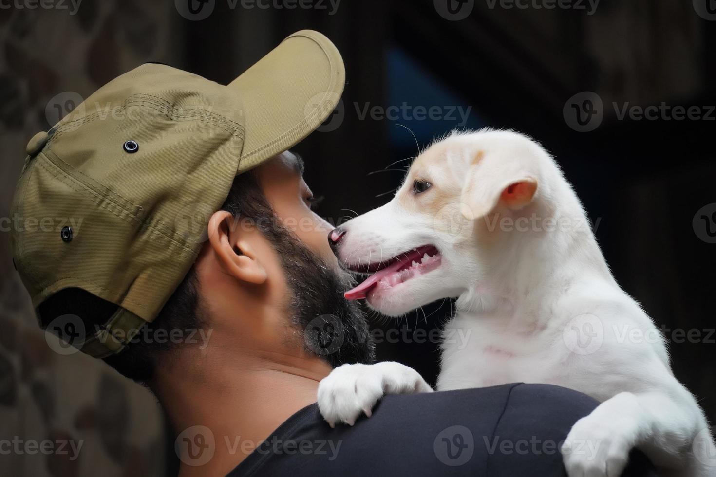 a dog lover image dog is licking to boy photo