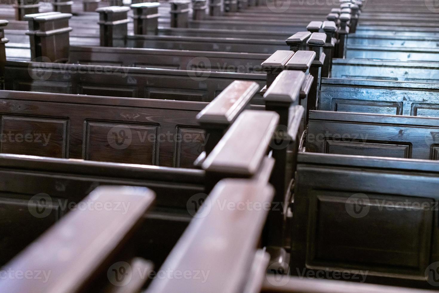Cathedral benches. Rows of pews in christian church. Heavy solid