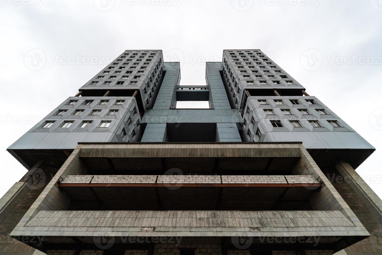 Abandoned high-rise building, cloudy weather, copy space. Unfinished shell construction. House of Soviets in Kaliningrad, Russia. photo