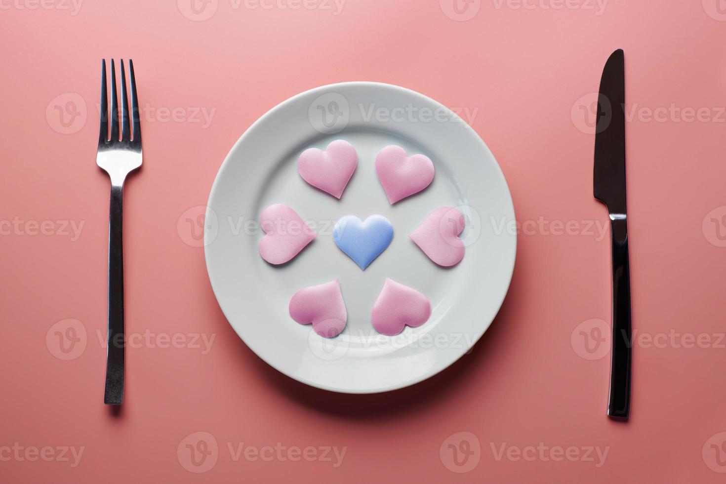 Hearts on plate. Woman and men love flirt. Choice among different sex partners. New girlfriend or boyfriend. Promiscuity and polygamy concept. photo