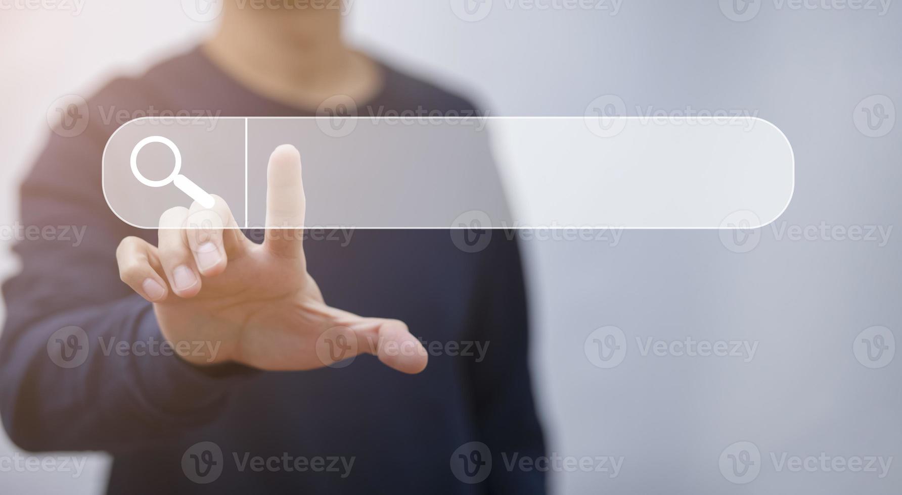 Businessman clicking internet search page on a computer touch screen or blank search bar,  internet and technology concept, Analysis the Internet to connect wirelessly, search engine optimization. photo