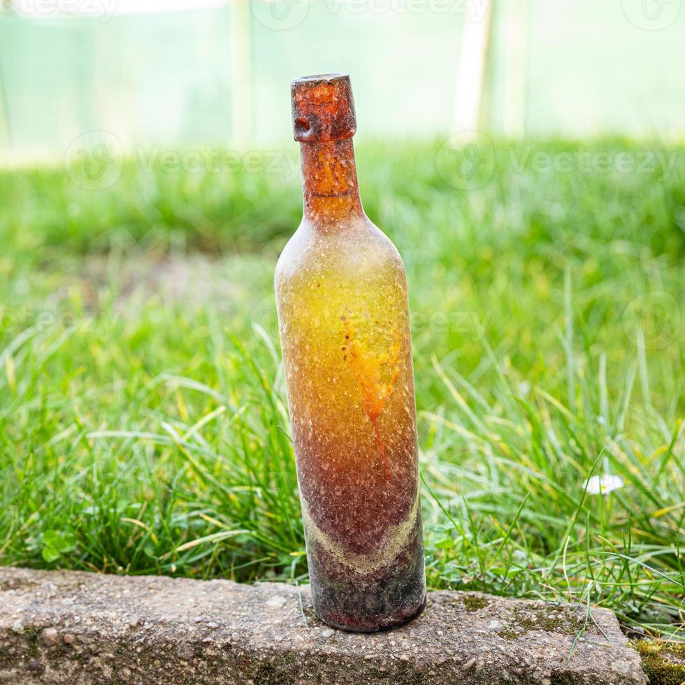 vintage bottle, glass bottle for wine empty dirty kitchenware photo