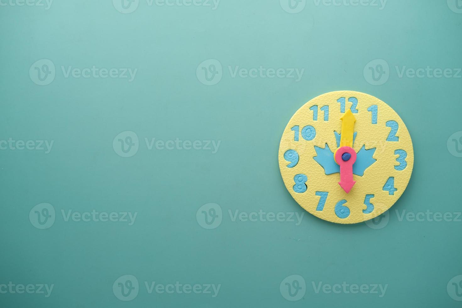 toy alarm clock on color background. photo