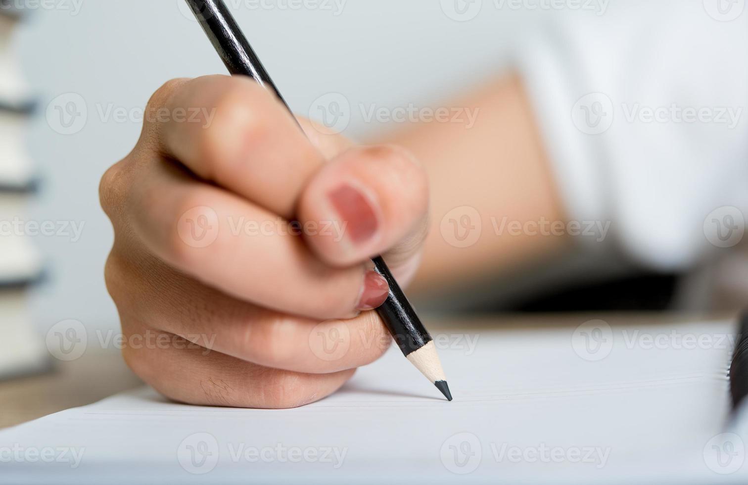 Hand and pencil pictures of students writing Education concept With copy space photo
