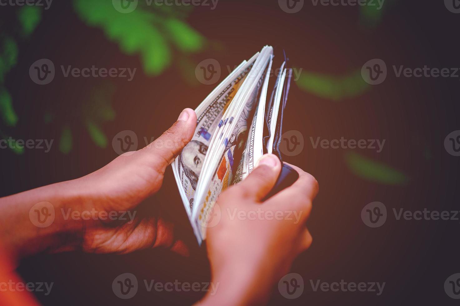 Dollar hand and purse images Concept of business finance photo