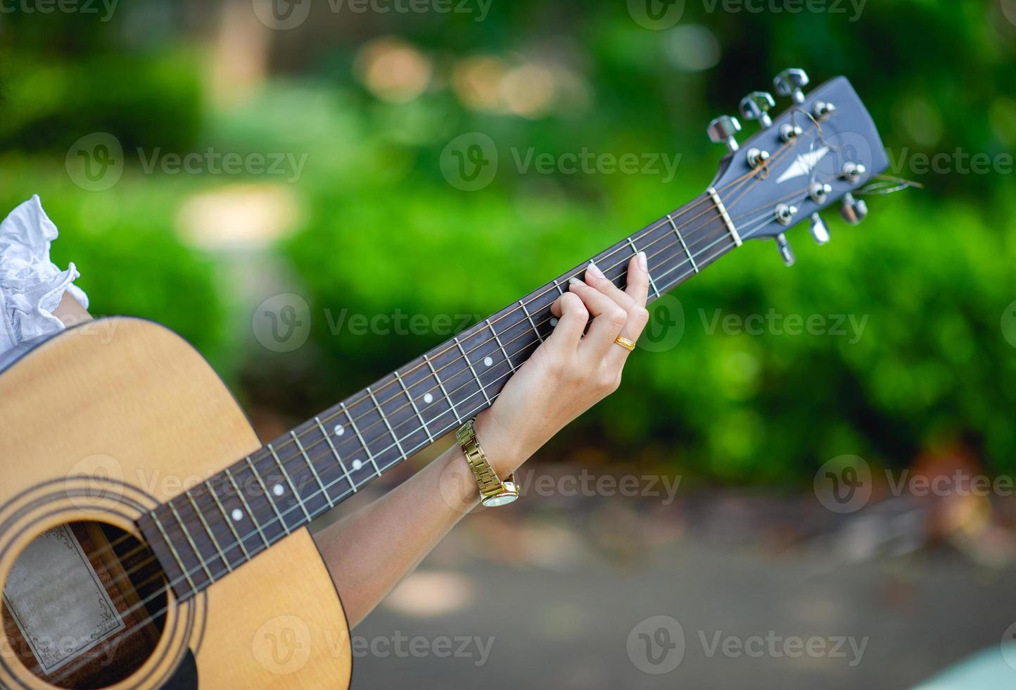 Musician hands and acoustic guitars, musical instruments with very good sound Musical instrument concept photo