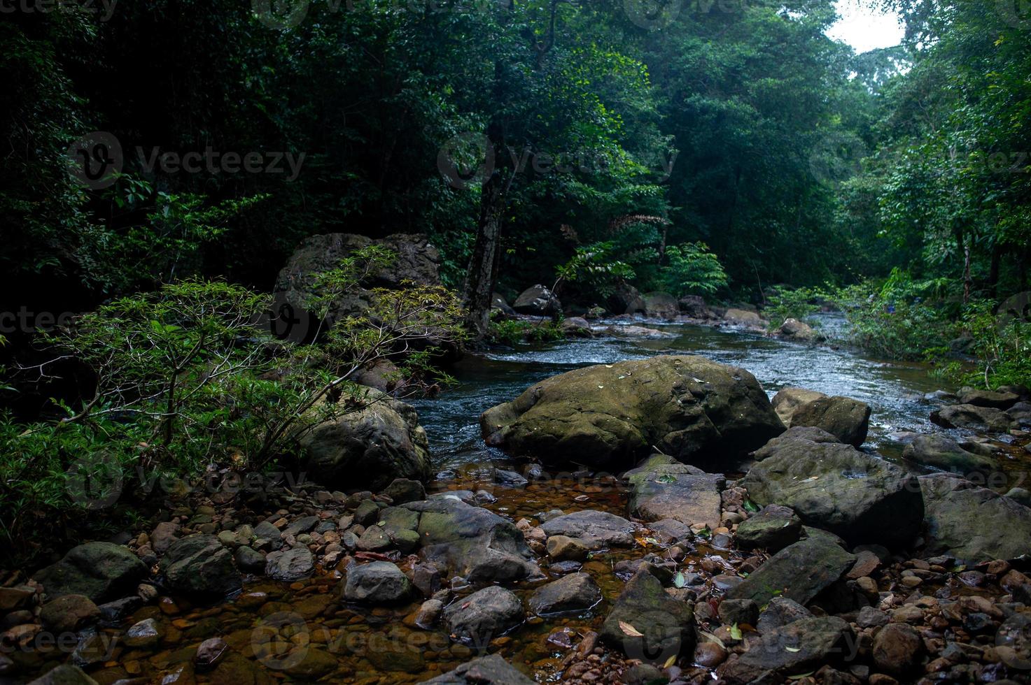 Natural waterfall, shoulder river, through the top of the mountain photo