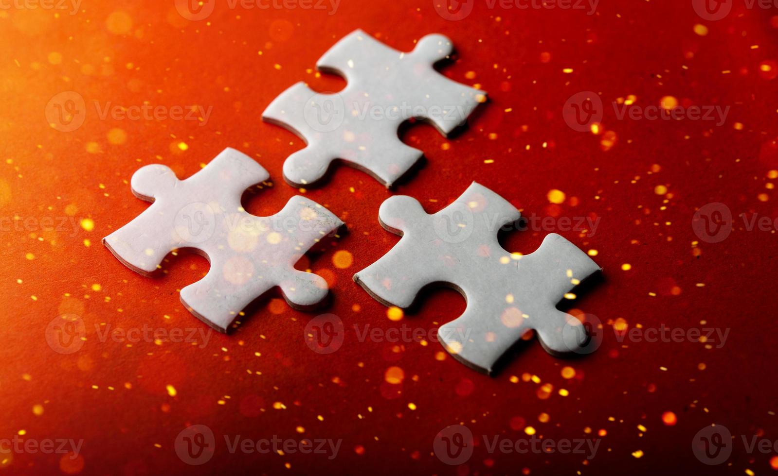 White puzzles placed on an orange background Represent the unity and power of successful people photo