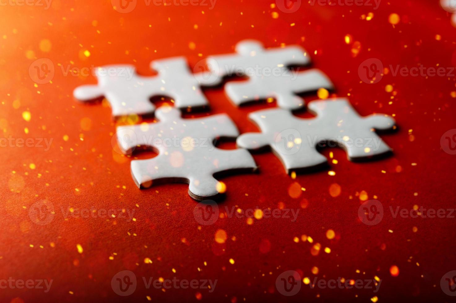 White puzzles placed on an orange background Represent the unity and power of successful people photo