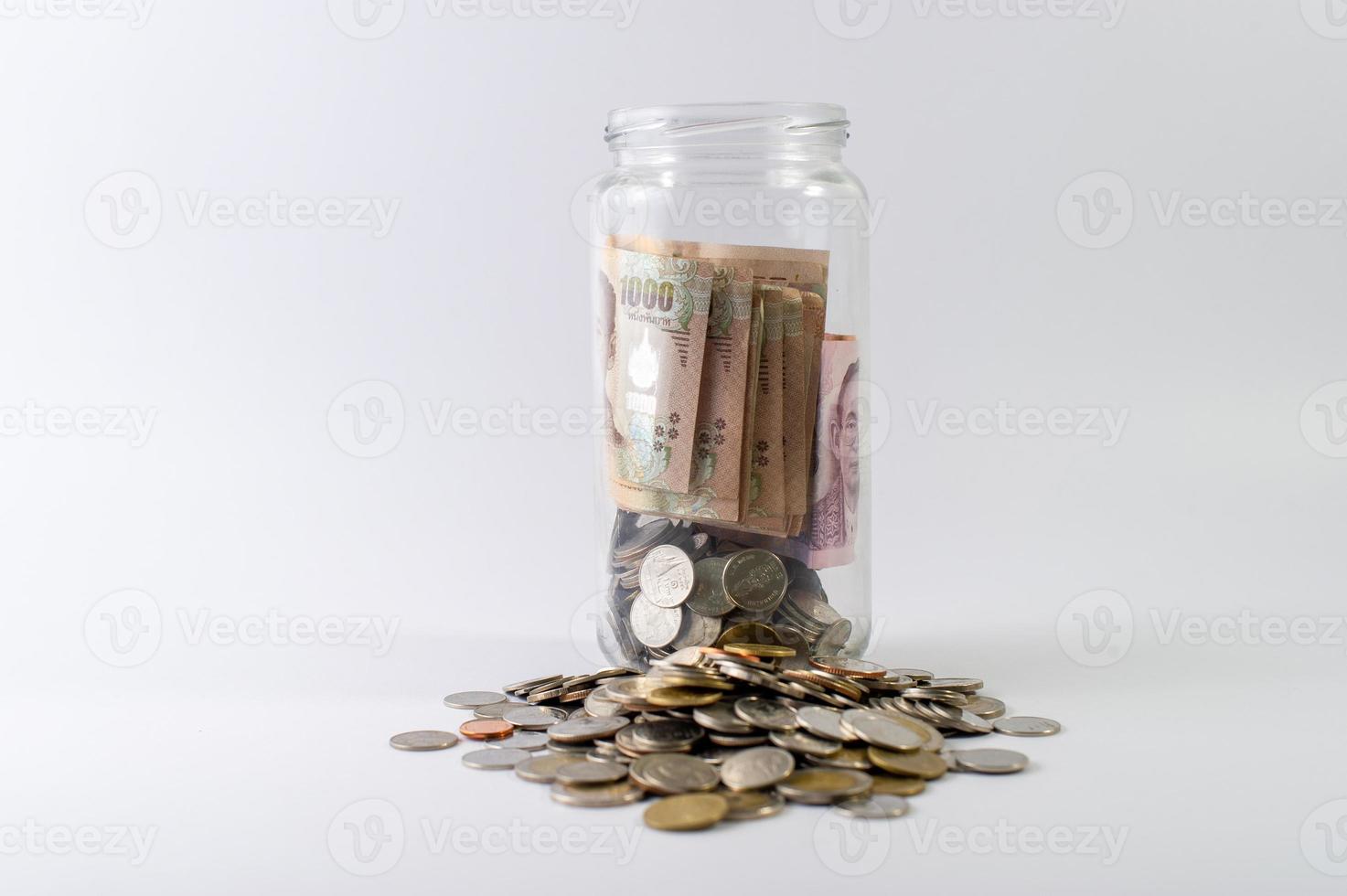 Saving money, saving money for the future ahead of life. And silver on a white background photo