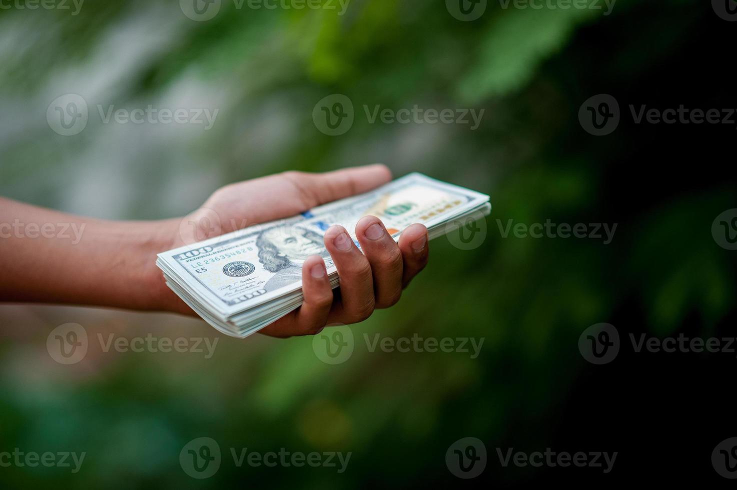 Hand and dollar pictures Concept of business finance photo