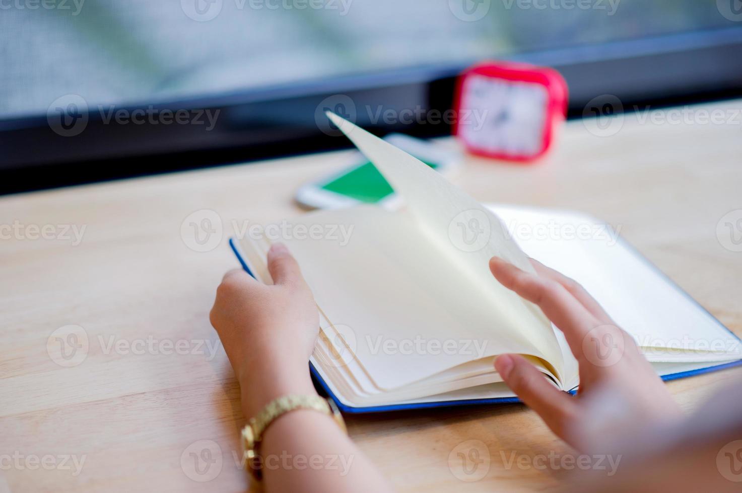 Hands and books that are laid bare with space In the morning room Book reading concept photo