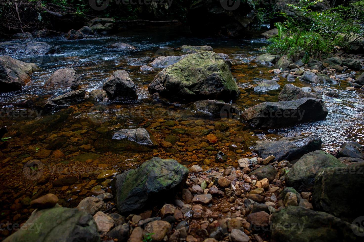 Natural waterfall, shoulder river, through the top of the mountain photo