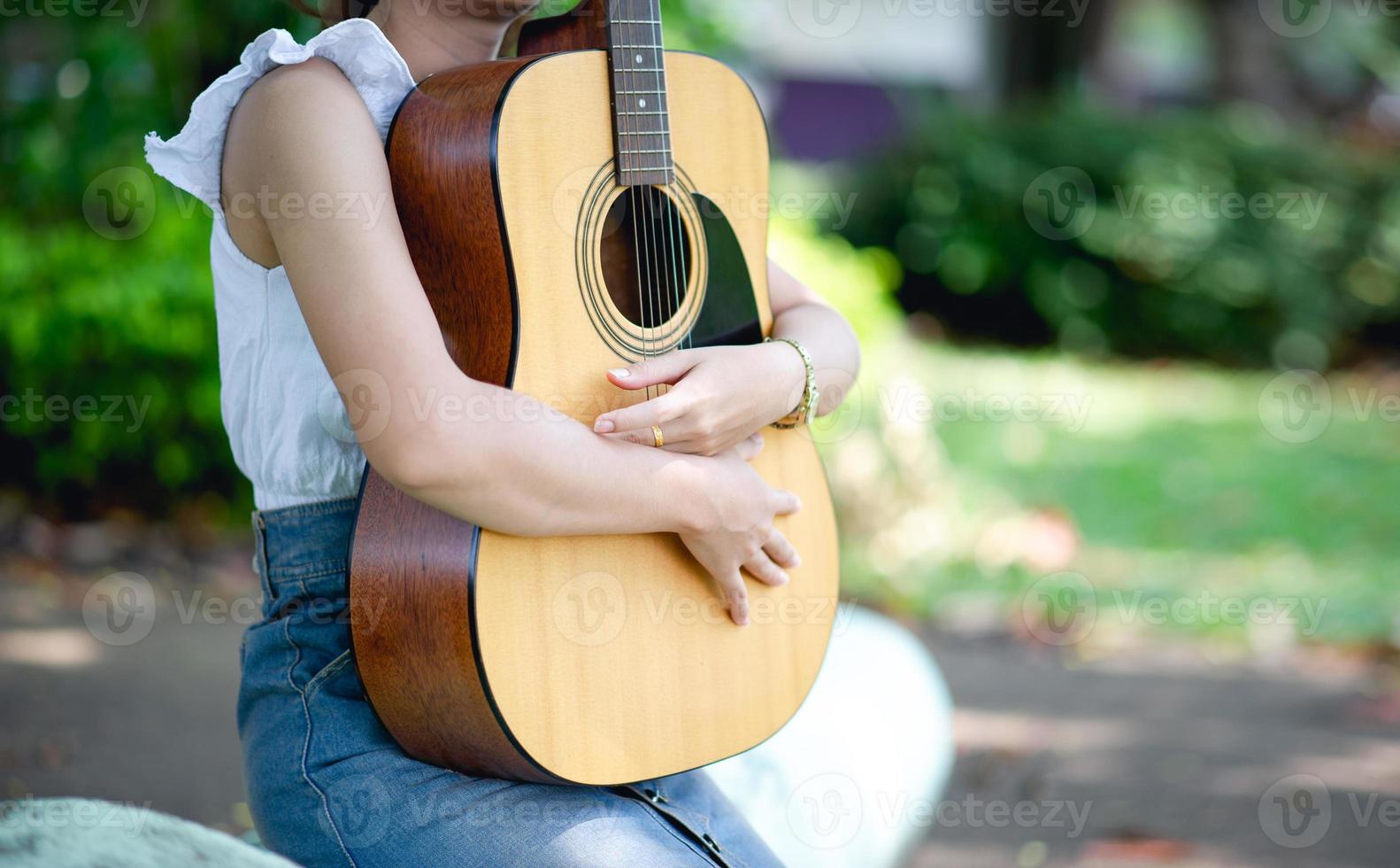 Musician hands and acoustic guitars, musical instruments with very good sound Musical instrument concept photo