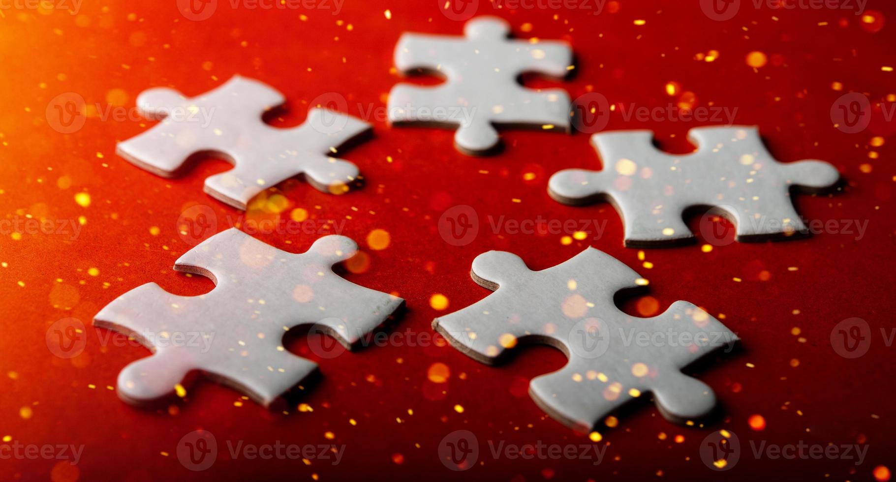 White puzzles placed on an orange background Represent the unity and power of successful people photo